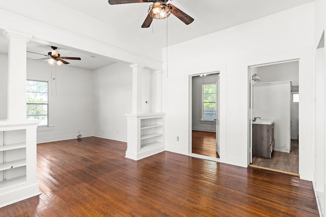 102 S Western Ave, Lampasas, TX 76550 - unfurnished room with a ceiling fan, ornate columns, and plenty of natural light