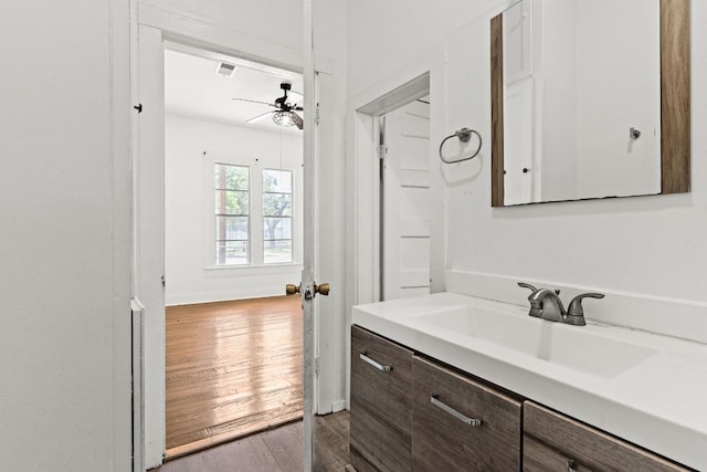 102 S Western Ave, Lampasas, TX 76550 - bathroom featuring ceiling fan, wood finished floors, and vanity