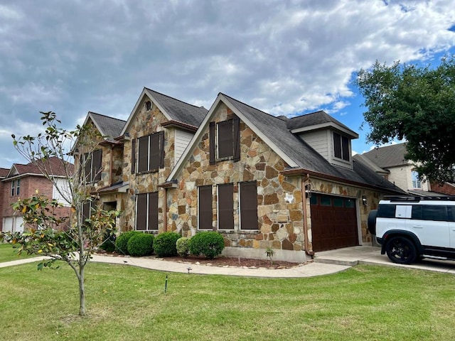 395 Spring Dr, Kyle, TX 78640 - view of front of property with stone siding, concrete driveway, a front yard, and a shingled roof