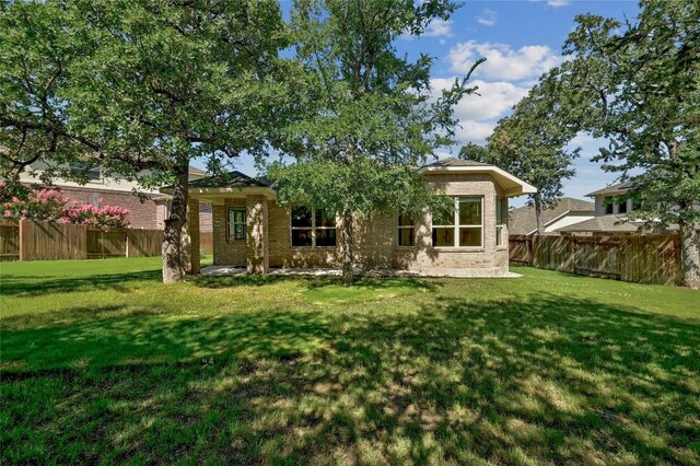 2232 Skippy Cv, Leander, TX 78641 - back of house featuring brick siding