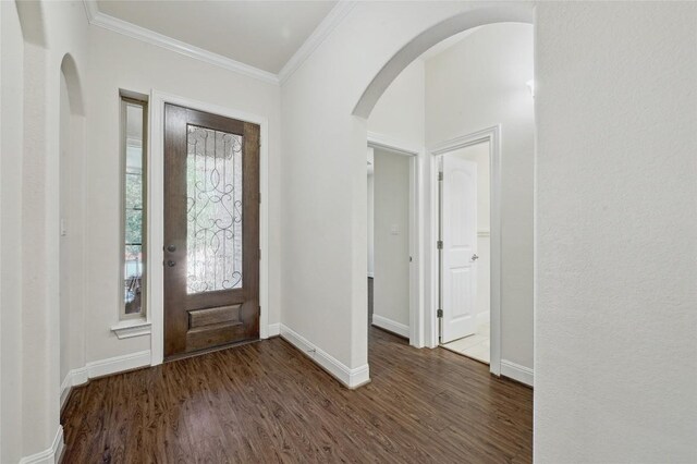 2232 Skippy Cv, Leander, TX 78641 - entryway with arched walkways, wood finished floors, and ornamental molding