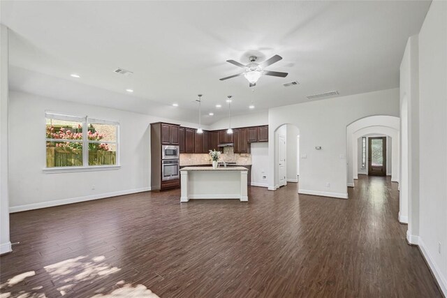 2232 Skippy Cv, Leander, TX 78641 - kitchen featuring open floor plan, arched walkways, a ceiling fan, decorative backsplash, and recessed lighting