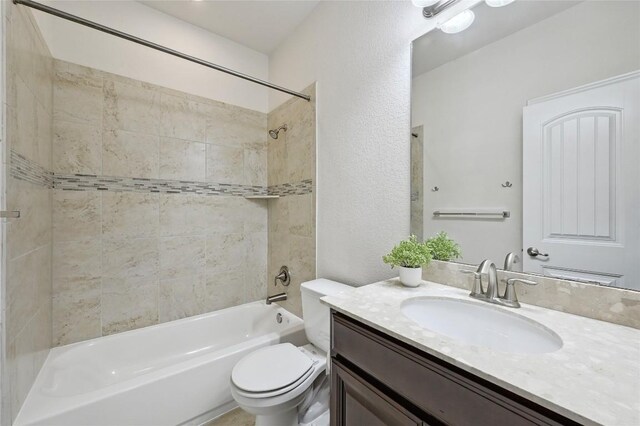 2232 Skippy Cv, Leander, TX 78641 - bathroom with vanity, shower / bath combination, and a textured wall