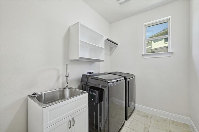 2232 Skippy Cv, Leander, TX 78641 - washroom with washer and clothes dryer and cabinet space