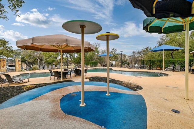 2232 Skippy Cv, Leander, TX 78641 - view of property's community featuring a pool and a patio