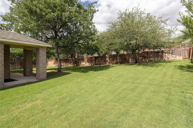 2232 Skippy Cv, Leander, TX 78641 - fenced backyard with a patio area
