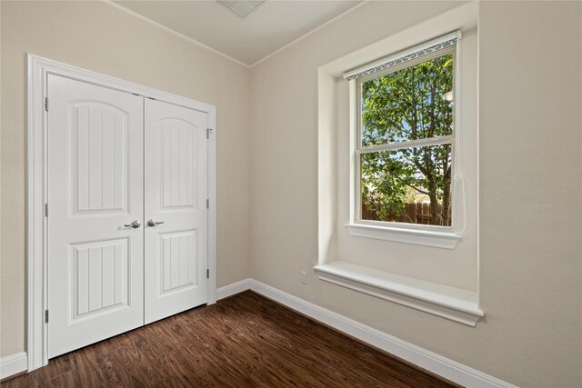2232 Skippy Cv, Leander, TX 78641 - unfurnished bedroom featuring dark wood-type flooring and a closet