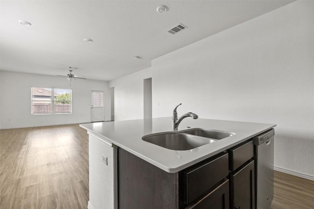11825 Monterosso Dr, Austin, TX 78754 - kitchen with light wood-style flooring, a ceiling fan, open floor plan, dishwasher, and an island with sink