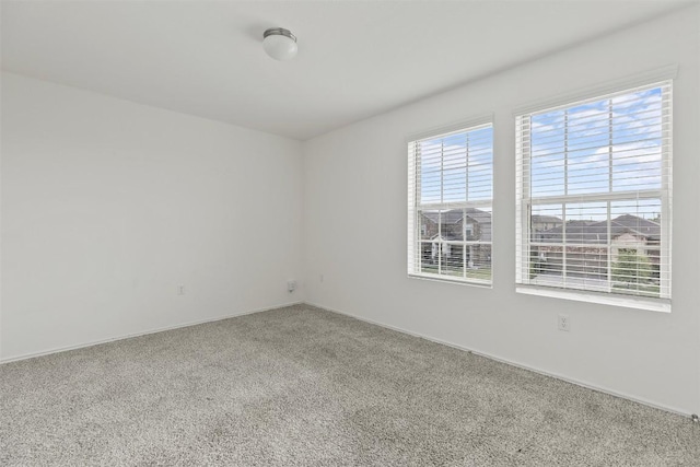 11825 Monterosso Dr, Austin, TX 78754 - carpeted spare room featuring baseboards