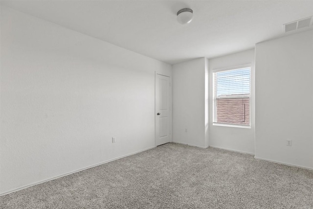 11825 Monterosso Dr, Austin, TX 78754 - spare room featuring light carpet and baseboards