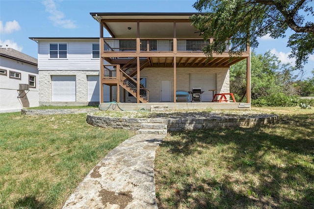 2806 Truman Cv, Lago Vista, TX 78645 - back of property featuring an attached garage, stairway, a deck, a lawn, and a patio