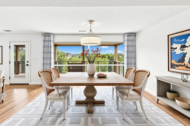2806 Truman Cv, Lago Vista, TX 78645 - dining room featuring light wood-style flooring and baseboards