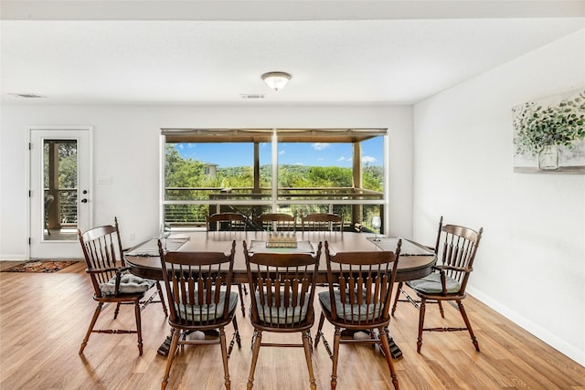 2806 Truman Cv, Lago Vista, TX 78645 - dining room with light wood-style floors and plenty of natural light