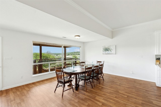 2806 Truman Cv, Lago Vista, TX 78645 - dining room with wood finished floors and crown molding