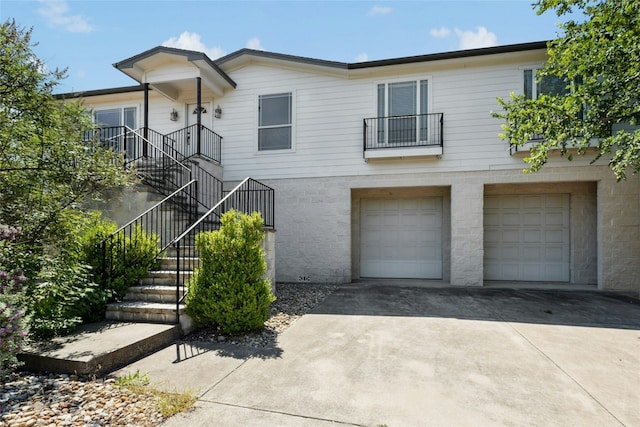 2806 Truman Cv, Lago Vista, TX 78645 - view of front of property with driveway, an attached garage, and stairway
