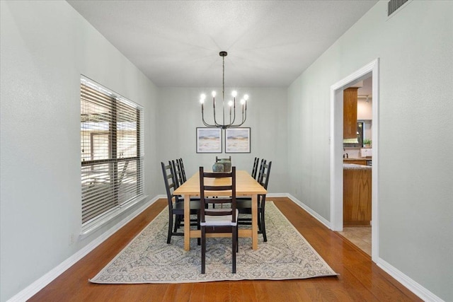 3004 Quail Run Dr, Round Rock, TX 78681 - dining space featuring a chandelier and dark wood-type flooring