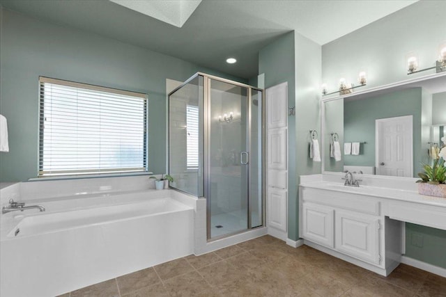 3004 Quail Run Dr, Round Rock, TX 78681 - bathroom featuring a bath, a shower stall, vanity, tile patterned flooring, and a skylight