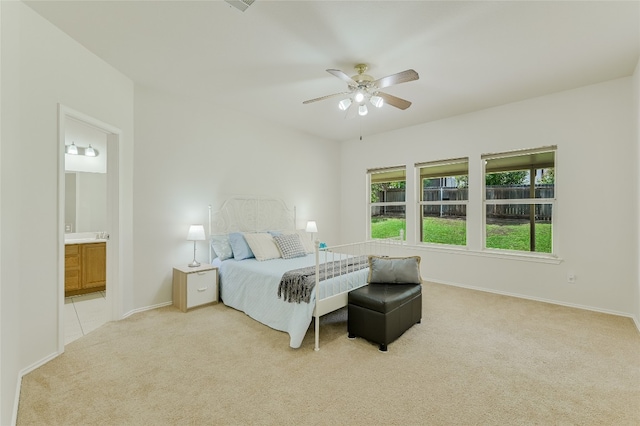 7008 Wandering Oak Rd, Austin, TX 78749 - bedroom with carpet floors, connected bathroom, and ceiling fan