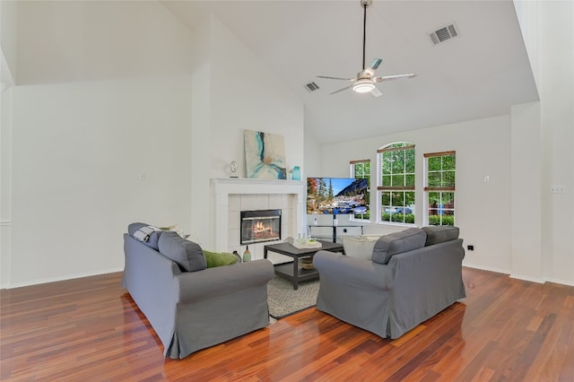 7008 Wandering Oak Rd, Austin, TX 78749 - living room featuring high vaulted ceiling, wood finished floors, a ceiling fan, and a fireplace