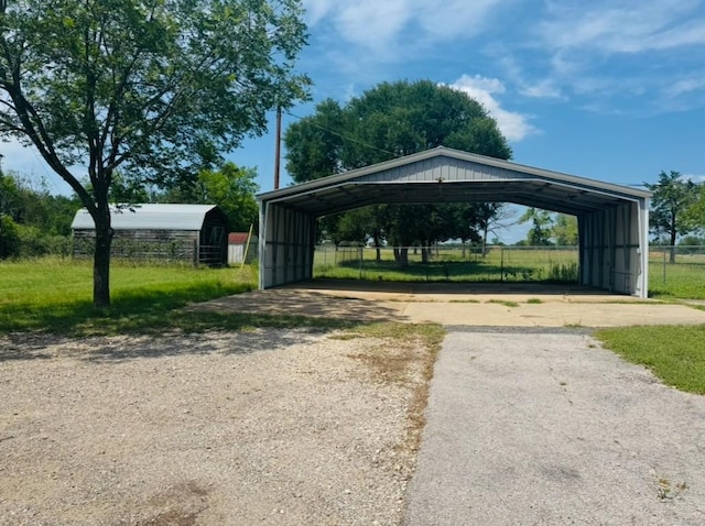 224 Crooked Hollow Dr, Elgin, TX 78621 - view of vehicle parking featuring a detached carport and asphalt driveway