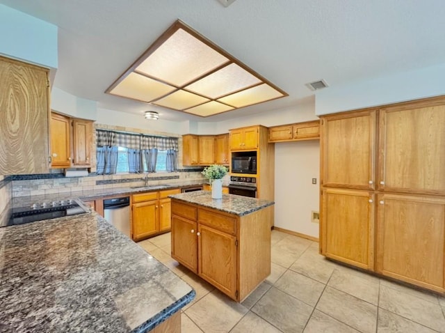224 Crooked Hollow Dr, Elgin, TX 78621 - kitchen featuring black microwave, oven, tasteful backsplash, and light tile patterned flooring
