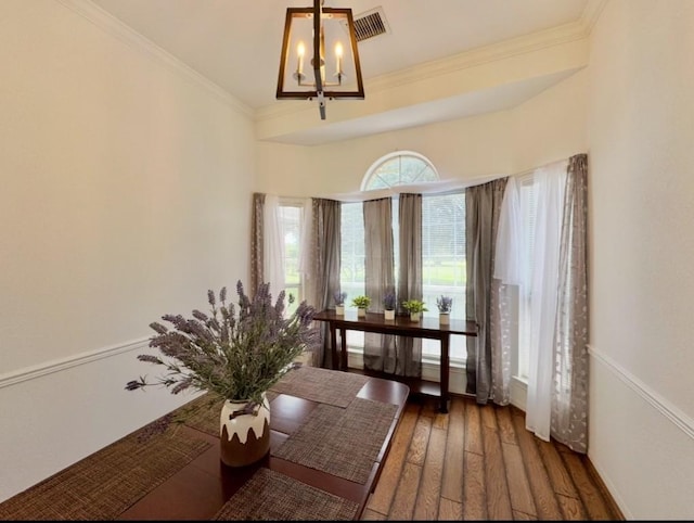 224 Crooked Hollow Dr, Elgin, TX 78621 - living area with a chandelier, wood finished floors, and crown molding