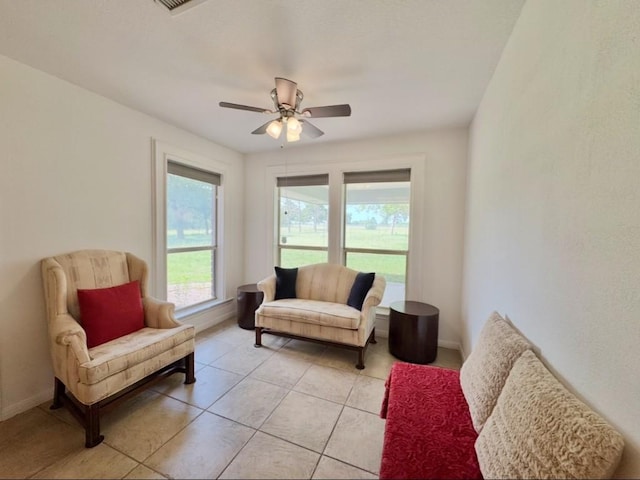 224 Crooked Hollow Dr, Elgin, TX 78621 - living room with ceiling fan and light tile patterned floors