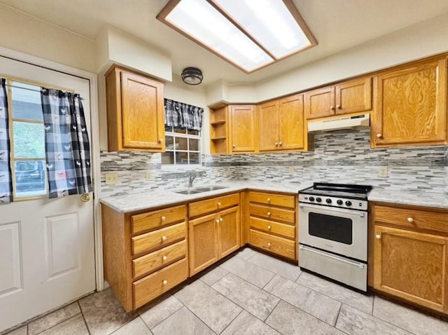 224 Crooked Hollow Dr, Elgin, TX 78621 - kitchen with stainless steel range with gas cooktop, under cabinet range hood, decorative backsplash, light tile patterned floors, and open shelves