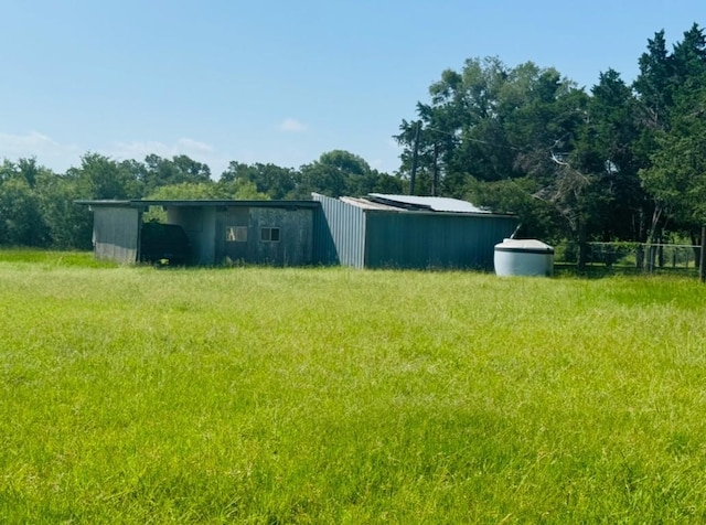 224 Crooked Hollow Dr, Elgin, TX 78621 - view of yard featuring an outbuilding and a pole building