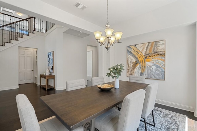 4108 Logan Ridge Dr, Cedar Park, TX 78613 - dining space with a chandelier, dark wood-style flooring, and stairs