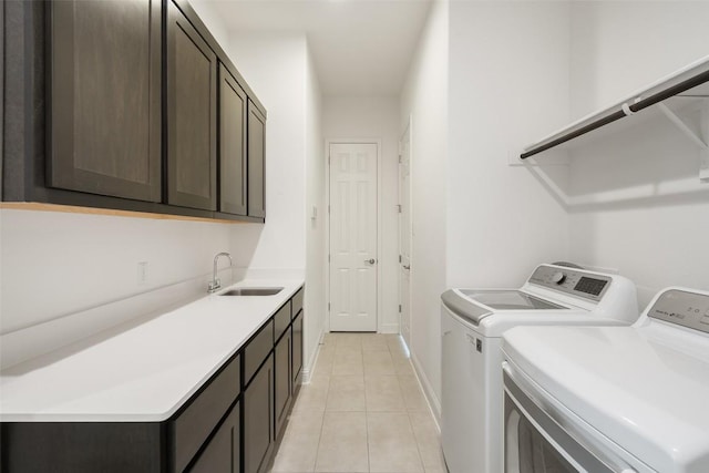 4108 Logan Ridge Dr, Cedar Park, TX 78613 - laundry area featuring independent washer and dryer, cabinet space, and light tile patterned floors