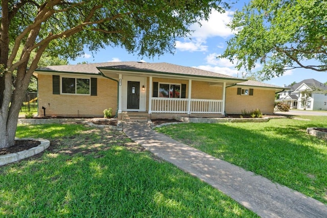 501 Meadowbrook Dr, Georgetown, TX 78628 - single story home with brick siding, a porch, and a front lawn