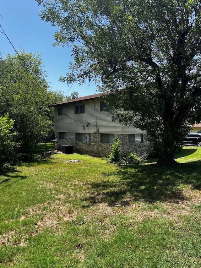 6005 Walnut Hills Dr, Austin, TX 78723 - rear view of house with a yard