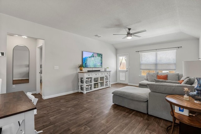 13911 Macquarie Dr, Pflugerville, TX 78660 - living area with ceiling fan, dark wood-type flooring, lofted ceiling, and a textured ceiling