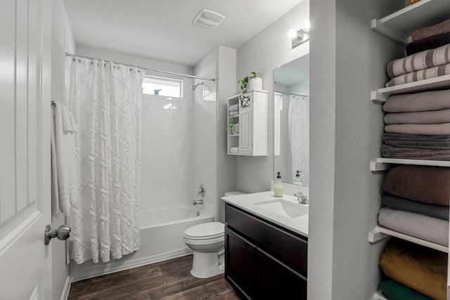 13911 Macquarie Dr, Pflugerville, TX 78660 - full bathroom with wood finished floors, shower / tub combo, and vanity
