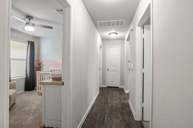 13911 Macquarie Dr, Pflugerville, TX 78660 - hallway with baseboards and wood finished floors