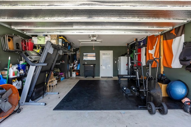 13911 Macquarie Dr, Pflugerville, TX 78660 - garage with freestanding refrigerator and a garage door opener