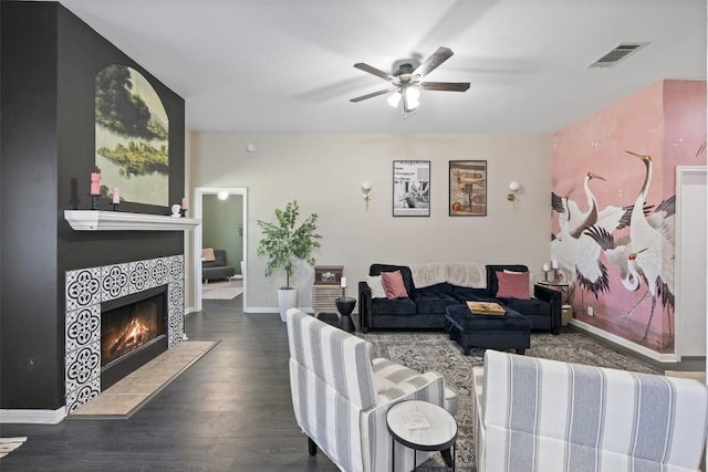 6001 Andross Ct, Hutto, TX 78634 - living area with a ceiling fan, a tile fireplace, and wood finished floors