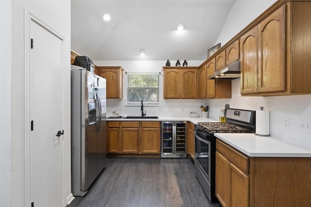 6001 Andross Ct, Hutto, TX 78634 - kitchen featuring stainless steel gas stove, fridge with ice dispenser, under cabinet range hood, wine cooler, and lofted ceiling