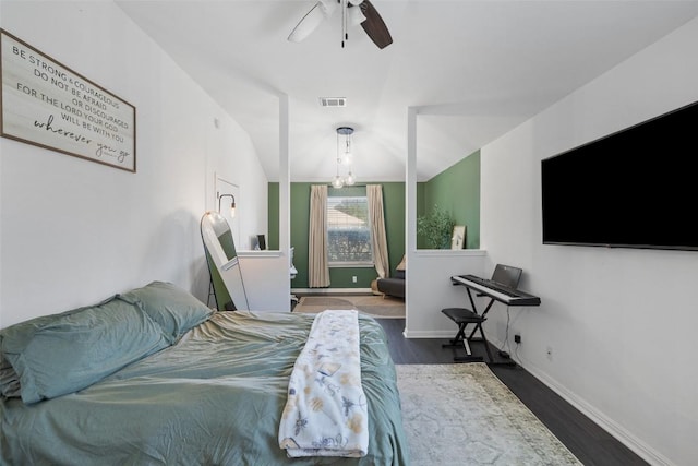 6001 Andross Ct, Hutto, TX 78634 - bedroom with wood finished floors, a chandelier, and a ceiling fan