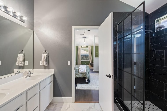 6001 Andross Ct, Hutto, TX 78634 - ensuite bathroom featuring double vanity, a marble finish shower, and marble finish floors