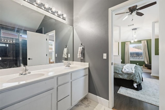6001 Andross Ct, Hutto, TX 78634 - bathroom with double vanity, ensuite bath, a ceiling fan, and a shower