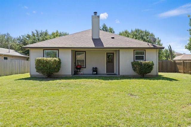 6001 Andross Ct, Hutto, TX 78634 - rear view of house with a fenced backyard, stucco siding, a patio, a chimney, and a shingled roof