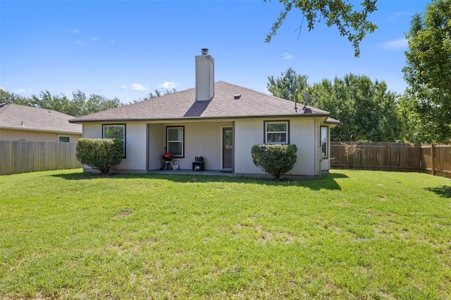 6001 Andross Ct, Hutto, TX 78634 - back of property featuring a chimney, a fenced backyard, stucco siding, a patio area, and roof with shingles