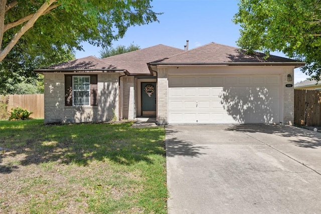6001 Andross Ct, Hutto, TX 78634 - single story home with brick siding, concrete driveway, an attached garage, and a shingled roof