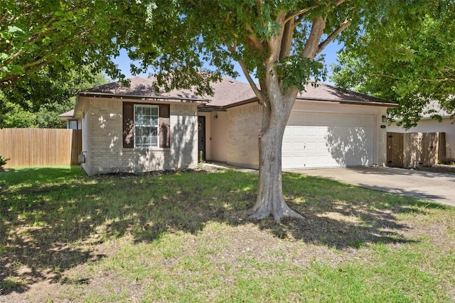 6001 Andross Ct, Hutto, TX 78634 - ranch-style house with an attached garage, driveway, and brick siding