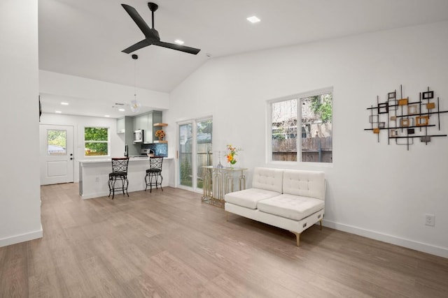 7913 W Gate Blvd Unit A, Austin, TX 78745 - living area featuring ceiling fan, vaulted ceiling, light wood finished floors, plenty of natural light, and recessed lighting