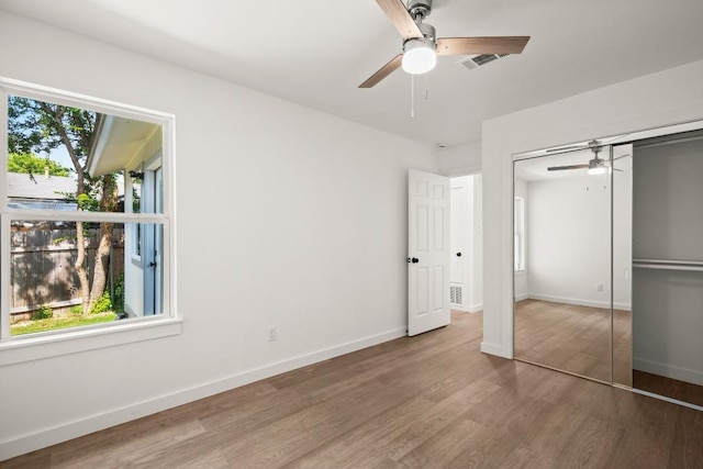 7913 W Gate Blvd Unit A, Austin, TX 78745 - unfurnished bedroom with wood finished floors, a closet, and ceiling fan