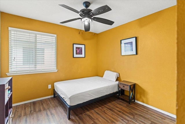 bedroom with wood finished floors and a ceiling fan