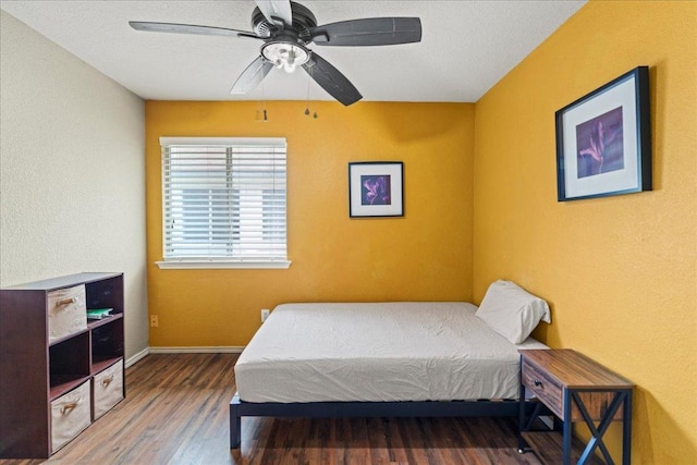 bedroom featuring wood finished floors and ceiling fan
